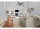 Bright living room with vaulted ceiling, fireplace, ceiling fan, and hardwood flooring at 1129 Shady Grove Ln, Mount Pleasant, SC 29464