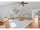 Bright living room featuring a neutral color palette, hardwood floors, and a ceiling fan at 1129 Shady Grove Ln, Mount Pleasant, SC 29464