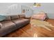 A bright, open loft area with a plush sofa and a cozy bed setup at 1129 Shady Grove Ln, Mount Pleasant, SC 29464