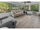 Bright sunroom with neutral furniture, exercise equipment, and large windows at 1129 Shady Grove Ln, Mount Pleasant, SC 29464
