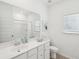 Clean bathroom features white vanity, large mirror, and shower with neutral-colored walls at 114 Rust Rail Way, Summerville, SC 29485