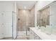 Modern bathroom with a glass-enclosed shower, double vanity, and tiled floor at 114 Rust Rail Way, Summerville, SC 29485