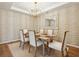 Bright dining room with a modern chandelier and neutral decor, creating a serene space for meals at 114 Rust Rail Way, Summerville, SC 29485