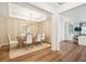 Elegant dining room with a stylish chandelier, patterned wallpaper, and seating for six, perfect for gatherings at 114 Rust Rail Way, Summerville, SC 29485