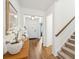 Welcoming entryway features hardwood floors, staircase, and stylish decor at 114 Rust Rail Way, Summerville, SC 29485