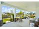 Spacious covered front porch with comfortable seating, offering serene outdoor views and neighborhood charm at 114 Rust Rail Way, Summerville, SC 29485