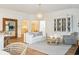 Well-lit living room with modern light fixture, neutral colors, stylish decor, and open floor plan create a welcoming atmosphere at 114 Rust Rail Way, Summerville, SC 29485