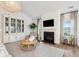 Inviting living room features a fireplace, custom built-ins, and stylish decor, creating a cozy and sophisticated ambiance at 114 Rust Rail Way, Summerville, SC 29485