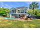 A backyard paradise featuring a pool, bar, fire pit, and outdoor seating, perfect for relaxation at 1143 Sea Eagle Watch, Charleston, SC 29412