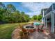 Backyard with fire pit and pond provides a peaceful outdoor living space for relaxing and entertaining at 1143 Sea Eagle Watch, Charleston, SC 29412