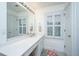 Simple bathroom featuring a double vanity with modern faucets, white cabinets and light-colored walls at 1143 Sea Eagle Watch, Charleston, SC 29412