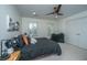 Bright bedroom with hardwood floors, a ceiling fan, and a comfortable bed with stylish pillows at 1143 Sea Eagle Watch, Charleston, SC 29412