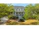 Charming two-story home with double front porches, complemented by a professionally landscaped front yard at 1143 Sea Eagle Watch, Charleston, SC 29412
