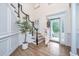 Bright, spacious foyer with staircase and wood floors, leading to the living areas at 1143 Sea Eagle Watch, Charleston, SC 29412