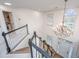 Bright foyer featuring a staircase, chandelier, and large windows creating an inviting entrance at 1143 Sea Eagle Watch, Charleston, SC 29412