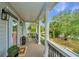 Inviting front porch featuring rocking chair, complemented by charming decor and serene views at 1143 Sea Eagle Watch, Charleston, SC 29412