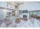 Bright living room featuring a fireplace, plush seating, high ceilings, and a ceiling fan at 1143 Sea Eagle Watch, Charleston, SC 29412