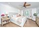 Cozy main bedroom featuring a ceiling fan, bedside tables, a dresser, and a seating area at 1143 Sea Eagle Watch, Charleston, SC 29412