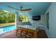 Outdoor bar area near the pool, featuring a quartz countertop and a ceiling fan at 1143 Sea Eagle Watch, Charleston, SC 29412