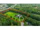 Aerial view outlining the property's boundaries that feature mature trees, landscaping, and an estate home at 120 Greenhill Pastures, Summerville, SC 29483