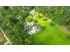 Expansive property featuring a house, pool, solar panels, and lush greenery at 120 Greenhill Pastures, Summerville, SC 29483
