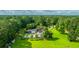 Aerial view of home, in-ground pool, and lush, expansive wooded property at 120 Greenhill Pastures, Summerville, SC 29483