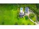 Aerial view of the property showcasing green lawn, house and a private pool at 120 Greenhill Pastures, Summerville, SC 29483