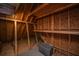 View of attic storage space with plywood walls and exposed beams, offering potential for organization at 120 Greenhill Pastures, Summerville, SC 29483