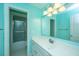Bright bathroom features a single sink vanity and a tub with sliding glass doors at 120 Greenhill Pastures, Summerville, SC 29483
