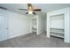 Bedroom features built-in shelving and desk, carpeted floors, and ceiling fan at 120 Greenhill Pastures, Summerville, SC 29483