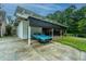 Detached carport featuring a vintage car, alongside a home with ample parking at 120 Greenhill Pastures, Summerville, SC 29483