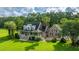 A beautiful two-story home with a brick facade, dormer windows and a welcoming porch at 120 Greenhill Pastures, Summerville, SC 29483