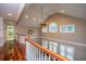 Elegant foyer with hardwood floors, cathedral ceiling, transom windows, and open staircase at 120 Greenhill Pastures, Summerville, SC 29483