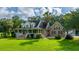 A charming home with a brick facade, dormer windows, and a welcoming front porch on a lush green lawn at 120 Greenhill Pastures, Summerville, SC 29483