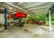 Well-equipped garage featuring a car lift, ample workspace, and organized equipment for auto enthusiasts at 120 Greenhill Pastures, Summerville, SC 29483