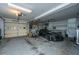 A car in a garage with an automatic door, utility lighting, and room for bikes and other equipment at 120 Greenhill Pastures, Summerville, SC 29483