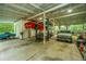 Large garage featuring a car lift, providing an abundance of space for vehicle maintenance and storage at 120 Greenhill Pastures, Summerville, SC 29483