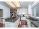 Open kitchen features granite counters, white cabinetry, and stainless steel appliances at 120 Greenhill Pastures, Summerville, SC 29483