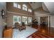 A spacious living room with hardwood floors, neutral walls, and large windows for natural light at 120 Greenhill Pastures, Summerville, SC 29483