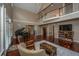Spacious living room with vaulted ceiling, rich wood floors, and a staircase view at 120 Greenhill Pastures, Summerville, SC 29483