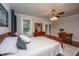 Inviting primary bedroom featuring hardwood floors, ceiling fan, and relaxing natural light at 120 Greenhill Pastures, Summerville, SC 29483