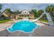 Backyard pool featuring a slide, lounge chairs, and an umbrella-covered table at 120 Greenhill Pastures, Summerville, SC 29483