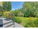 View from deck stairs to the meticulously maintained lawn and landscaping at 1208 Wynnwood Ct, Mount Pleasant, SC 29466