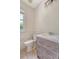 Powder room featuring wainscotting, a toilet, tile floors and a rustic vanity at 1208 Wynnwood Ct, Mount Pleasant, SC 29466