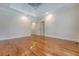 Large bedroom with tray ceiling, hardwood floors, neutral paint, and two closets at 1208 Wynnwood Ct, Mount Pleasant, SC 29466
