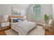 Cozy bedroom featuring a vaulted ceiling, arched window, and nautical decor at 1208 Wynnwood Ct, Mount Pleasant, SC 29466