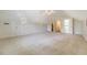 A spacious bedroom with neutral carpet and a ceiling fan, features a walk-in closet for ample storage at 1208 Wynnwood Ct, Mount Pleasant, SC 29466