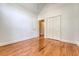 Empty bedroom with hardwood floors, closet, and plenty of natural light at 1208 Wynnwood Ct, Mount Pleasant, SC 29466