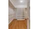 Walk-in closet with custom shelving and clothing rods at 1208 Wynnwood Ct, Mount Pleasant, SC 29466