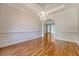 Formal dining room with hardwood floors, tray ceiling, chandelier, and detailed wainscoting at 1208 Wynnwood Ct, Mount Pleasant, SC 29466